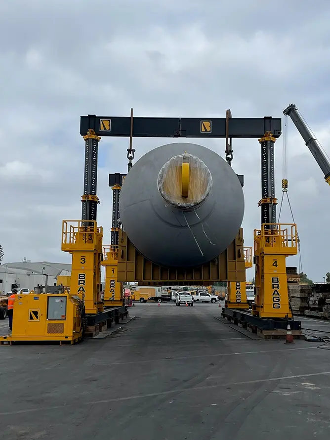 A crane lifting a large object, showcasing the power and precision of heavy machinery in construction.
